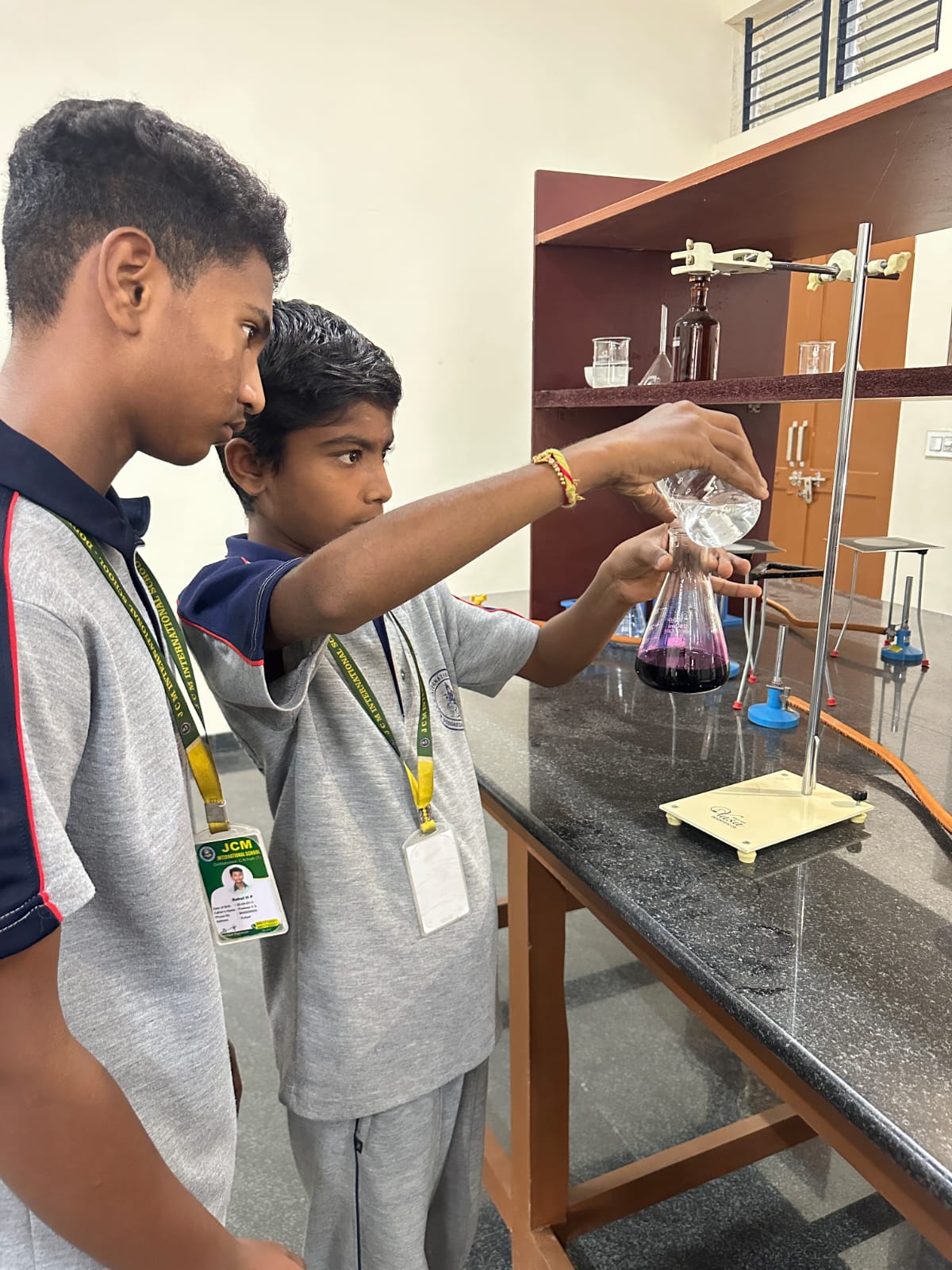 Students performing a titration in the chemistry lab
