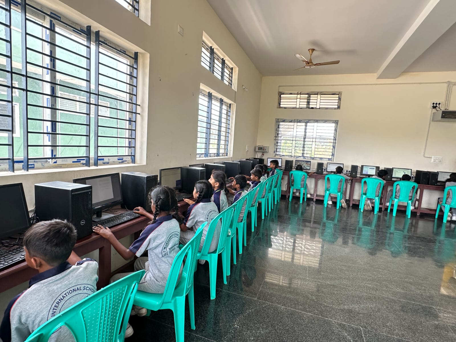 Students working on desktop computers in the computer lab