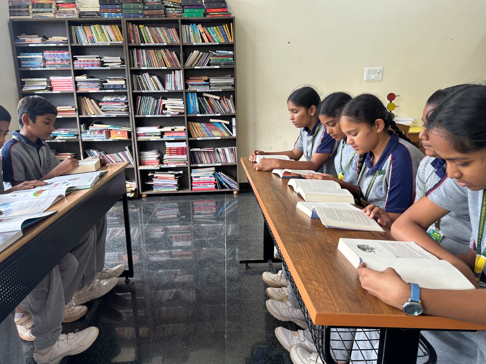 Students reading books in the school library